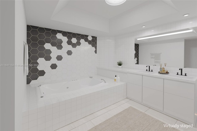 bathroom with tile walls, tile patterned floors, vanity, and tiled tub