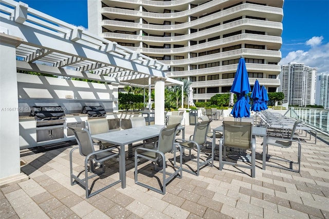 view of patio featuring a pergola and area for grilling