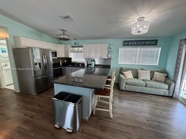 kitchen featuring sink, stainless steel fridge with ice dispenser, dark hardwood / wood-style flooring, and white cabinets