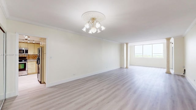 unfurnished living room with crown molding, a notable chandelier, and light wood-type flooring