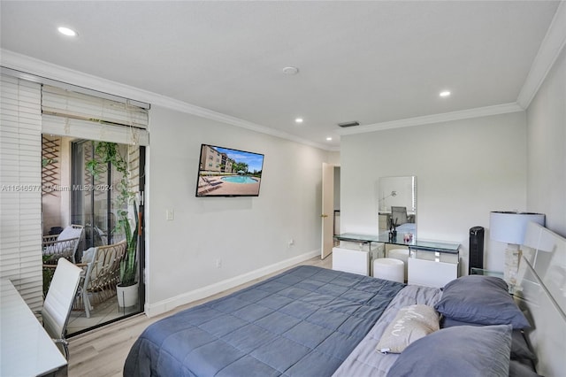 bedroom with light wood-type flooring and crown molding