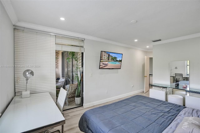 bedroom featuring crown molding and light hardwood / wood-style flooring