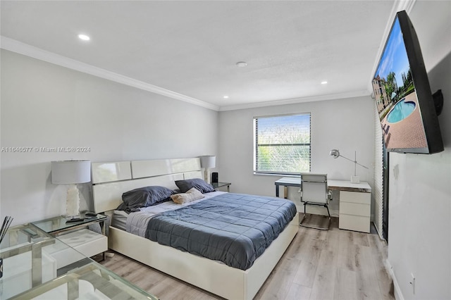 bedroom with light wood-type flooring and ornamental molding