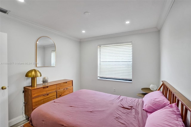 bedroom with crown molding