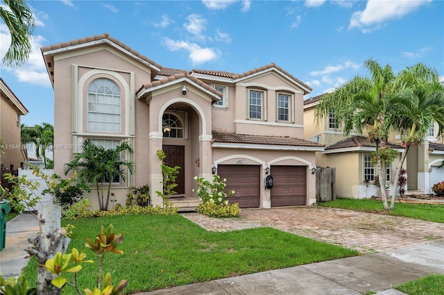 14107 SW 155th St, Miami, FL 33177 - mediterranean / spanish-style house with a tiled roof, stucco siding, a garage, a front lawn, and decorative driveway