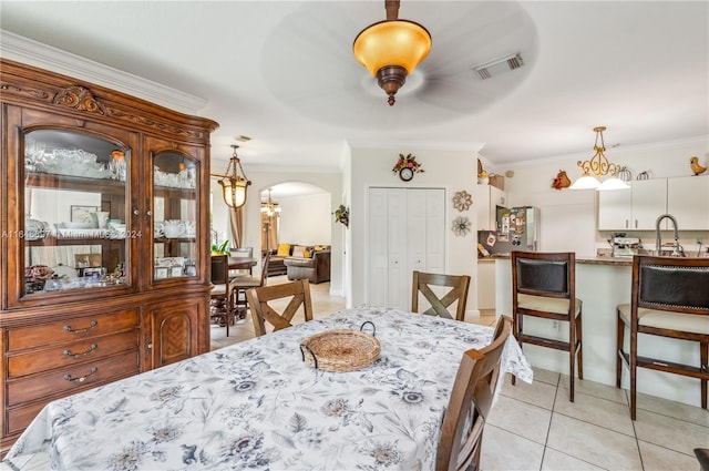 14107 SW 155th St, Miami, FL 33177 - dining room featuring arched walkways, ornamental molding, and light tile patterned floors