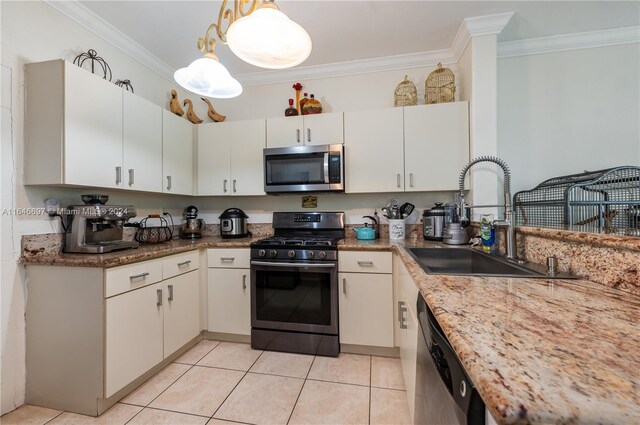 14107 SW 155th St, Miami, FL 33177 - kitchen featuring stainless steel appliances, a sink, ornamental molding, light tile patterned flooring, and white cabinets