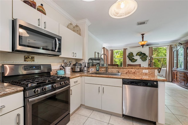 kitchen with white cabinetry, light stone countertops, sink, kitchen peninsula, and stainless steel appliances