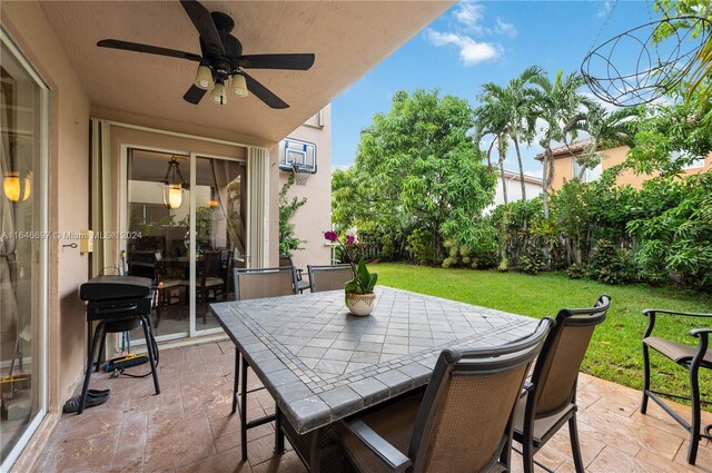 14107 SW 155th St, Miami, FL 33177 - view of patio with ceiling fan and outdoor dining space
