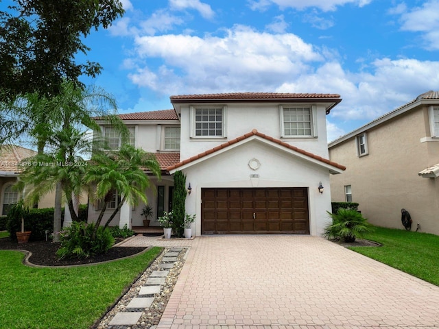 mediterranean / spanish-style home featuring a garage