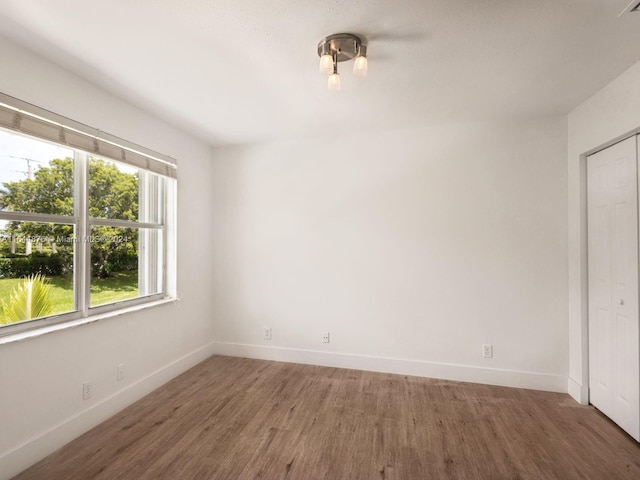 spare room featuring dark hardwood / wood-style floors