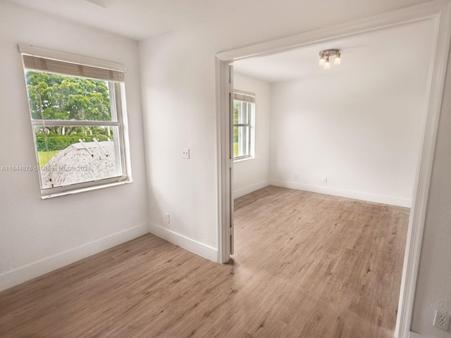 unfurnished room featuring light hardwood / wood-style flooring