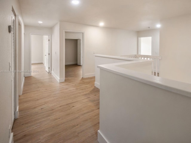 hallway with light wood-type flooring