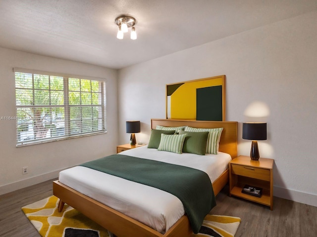 bedroom with wood-type flooring