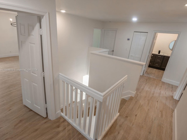 hallway with light hardwood / wood-style flooring