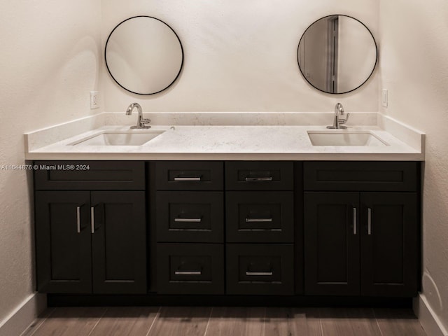 bathroom with hardwood / wood-style floors and vanity