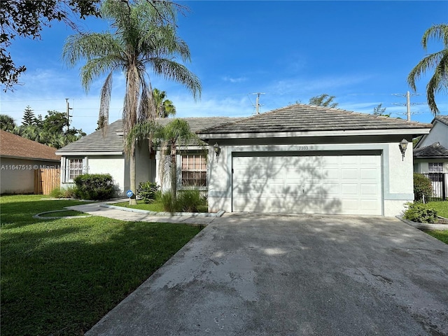 ranch-style home with a garage and a front yard