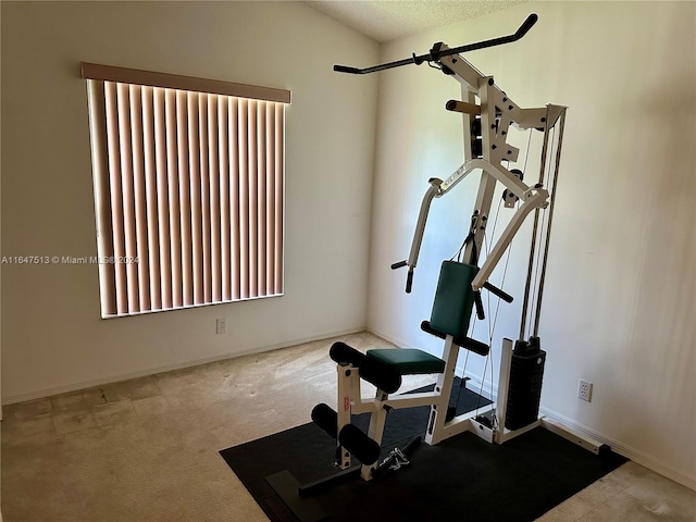 exercise room featuring a textured ceiling