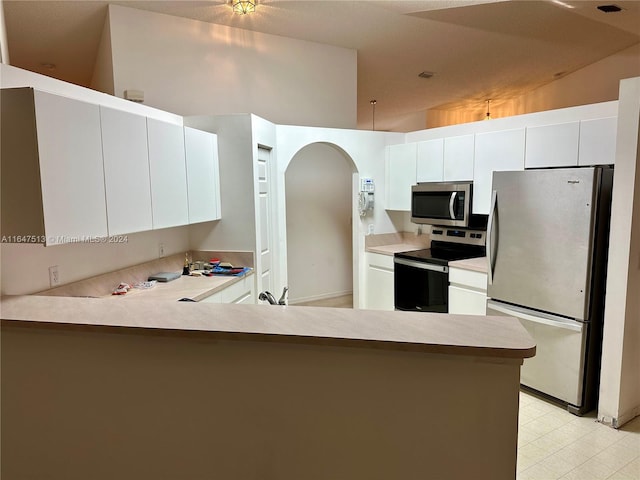 kitchen featuring stainless steel appliances, white cabinetry, lofted ceiling, kitchen peninsula, and light tile patterned flooring