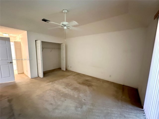 unfurnished bedroom with a closet, ceiling fan, and light colored carpet