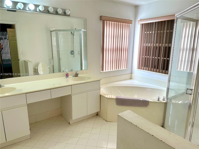 full bathroom featuring plus walk in shower, toilet, vanity, and tile patterned floors