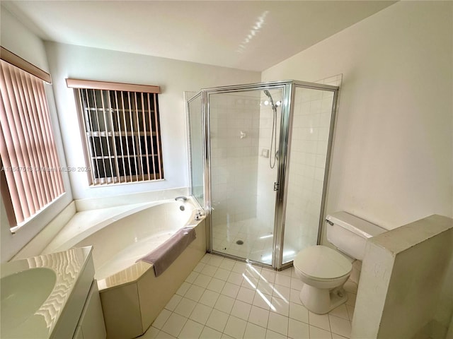 full bathroom featuring separate shower and tub, tile patterned floors, toilet, and vanity