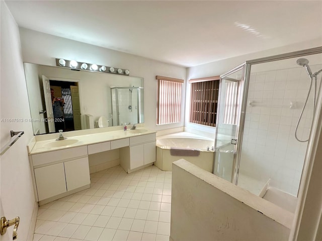 bathroom with plus walk in shower, tile patterned floors, and vanity