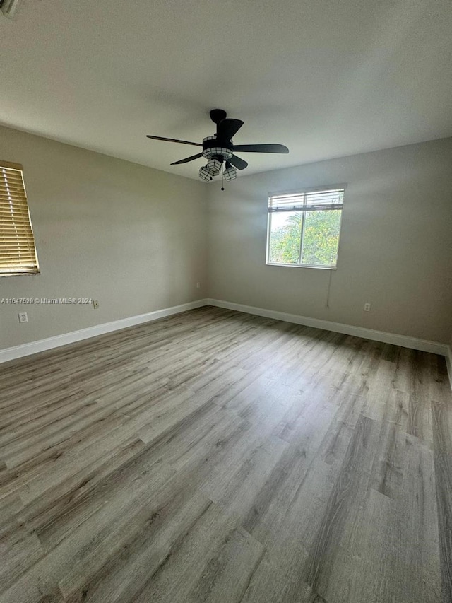 unfurnished room with a textured ceiling, ceiling fan, and hardwood / wood-style floors