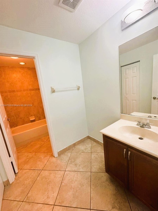 bathroom featuring vanity, a textured ceiling, tile patterned floors, and shower with separate bathtub