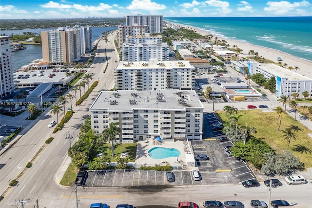 bird's eye view with a water view and a view of the beach