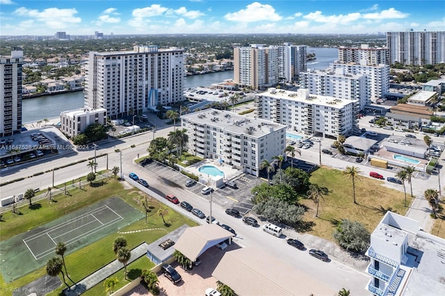 birds eye view of property with a view of city and a water view