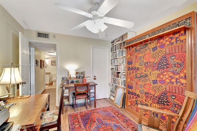 office featuring ceiling fan and light wood-type flooring