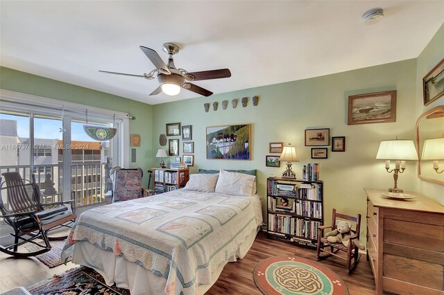 bedroom featuring access to exterior, ceiling fan, and hardwood / wood-style flooring