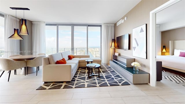 tiled living room with floor to ceiling windows