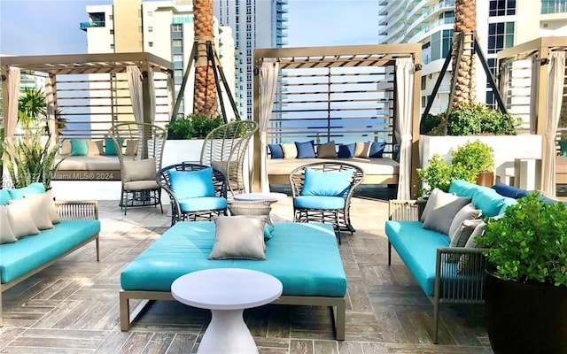 view of patio / terrace featuring a pergola and outdoor lounge area