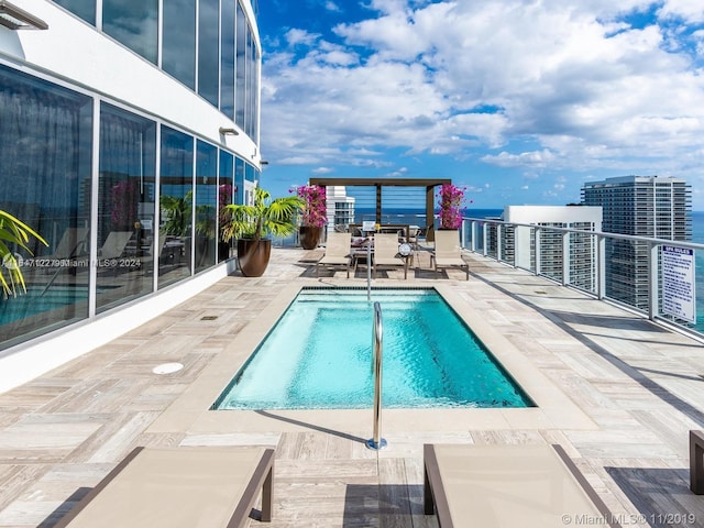 view of swimming pool with a patio area