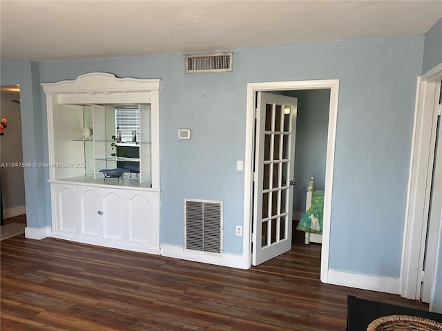 unfurnished living room with wood-type flooring