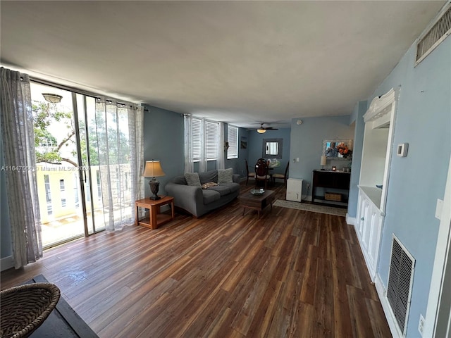 living room with ceiling fan and hardwood / wood-style flooring