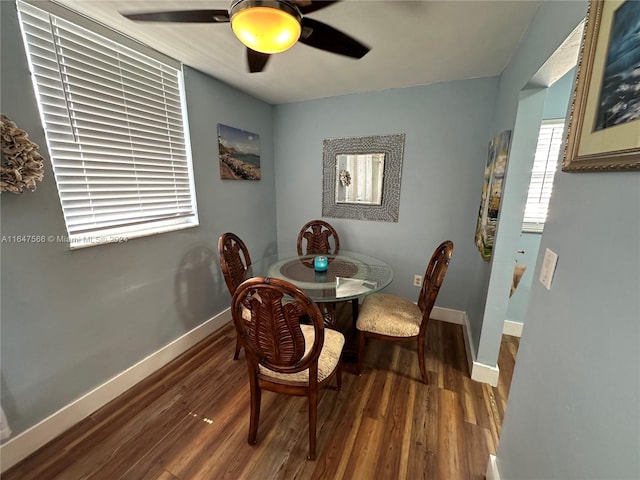 dining area featuring ceiling fan and wood-type flooring