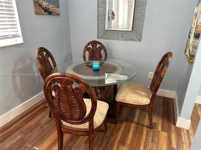 dining area with hardwood / wood-style floors