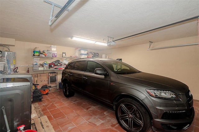 garage with a garage door opener and washer and clothes dryer