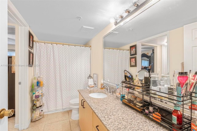 bathroom with visible vents, a shower with shower curtain, toilet, tile patterned flooring, and vanity