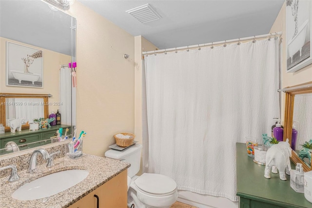 full bathroom featuring vanity, shower / tub combo with curtain, and toilet