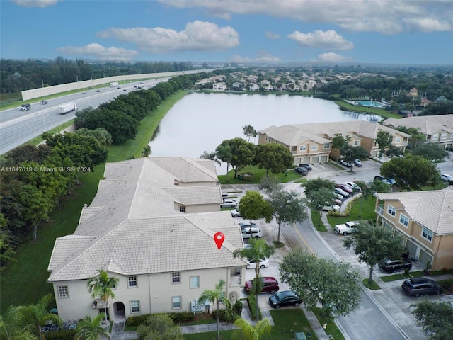 aerial view with a water view and a residential view