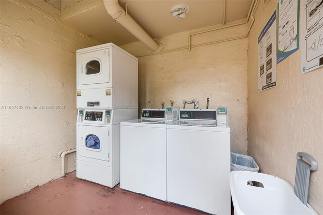 clothes washing area featuring stacked washer / dryer and separate washer and dryer