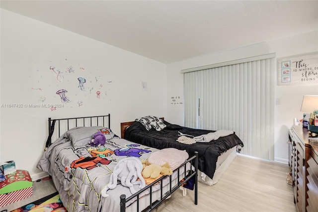 bedroom featuring light wood-type flooring