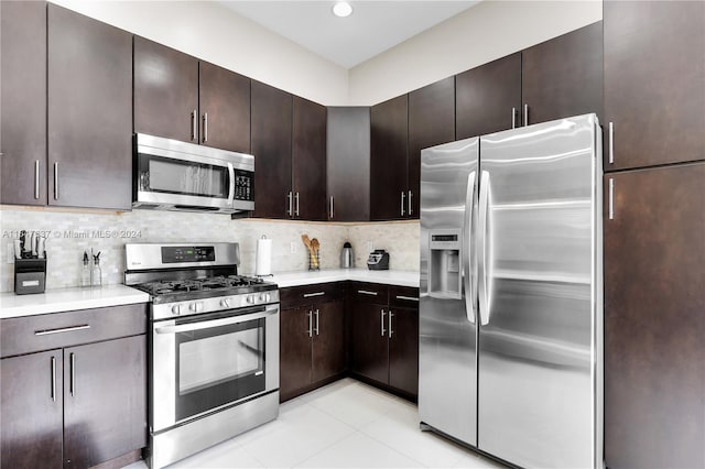 kitchen with decorative backsplash, dark brown cabinetry, and stainless steel appliances