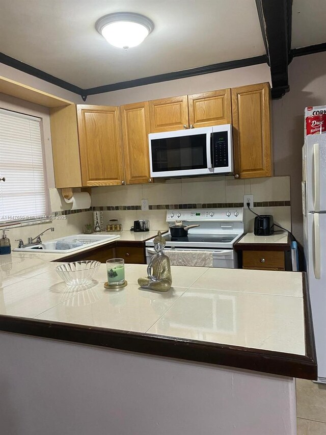 kitchen featuring crown molding, white range with electric stovetop, and tasteful backsplash