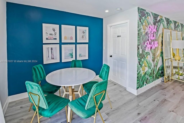 dining space featuring hardwood / wood-style floors