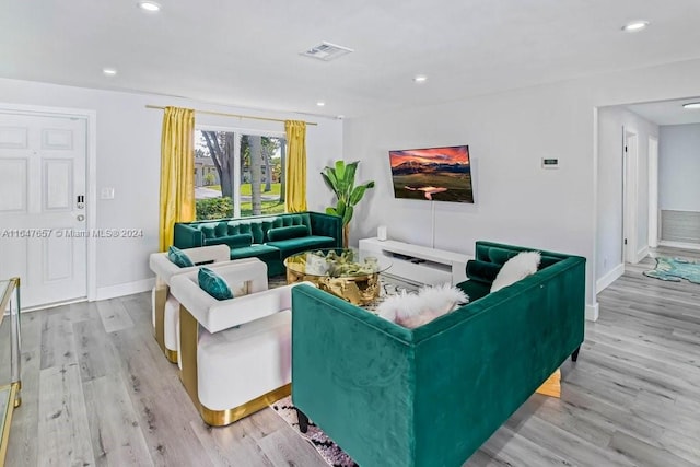 living room with light hardwood / wood-style flooring